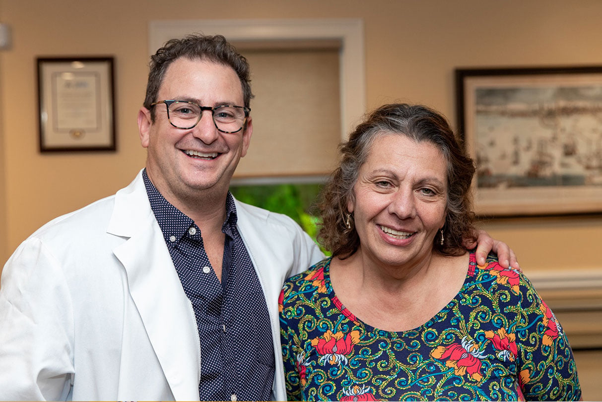 Dr. George and patient smiling